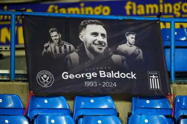 A tribute banner to former Sheffield United player George Baldock is seen in the stands before the Championship match at Elland Road, Leeds