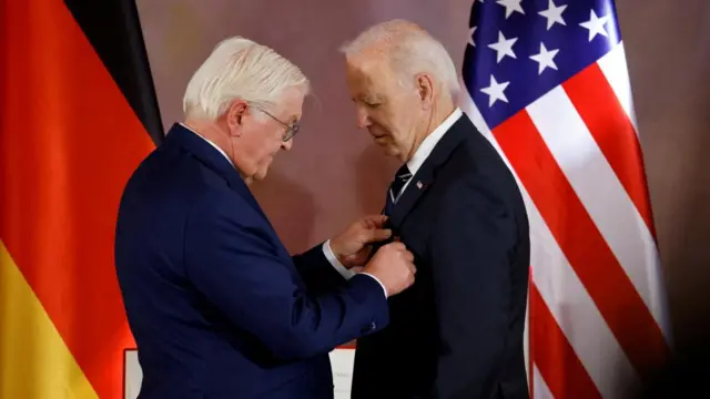 U.S. President Joe Biden reacts, as he is awarded Germany's highest honour, the Grand Cross of the Order of Merit for special achievements, by President Frank-Walter Steinmeier at a ceremony at Bellevue Palace in Berlin, Germany, October 18, 2024