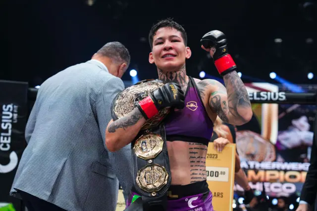 Larissa Pacheco celebrates with her PFL title