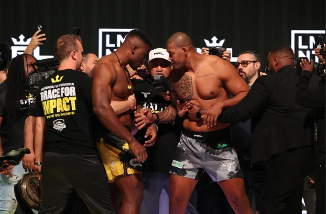 Francis Ngannou and Renan Ferreira are separated at a weigh-in