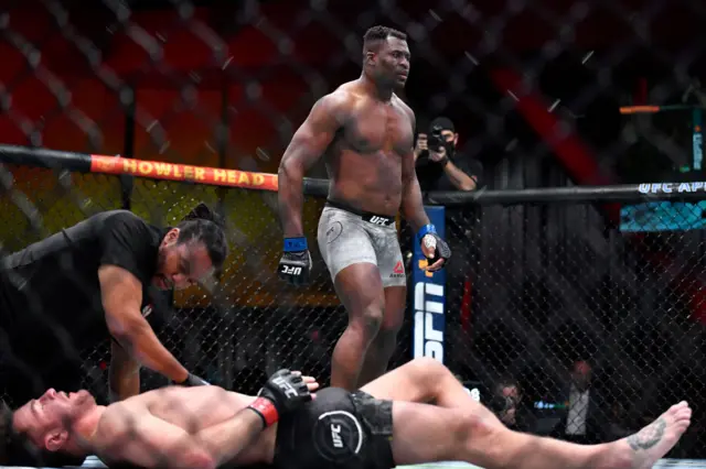 Francis Ngannou stands over an unconscious Stipe Miocic