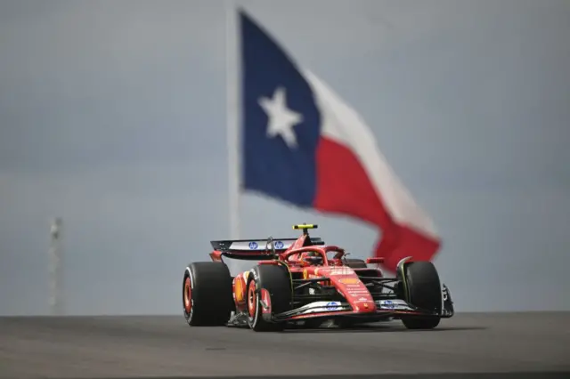 Carlos Sainz passes the Texas flag