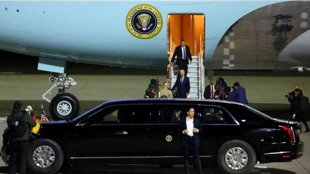 President Joe Biden walks down the steps of Air Force One