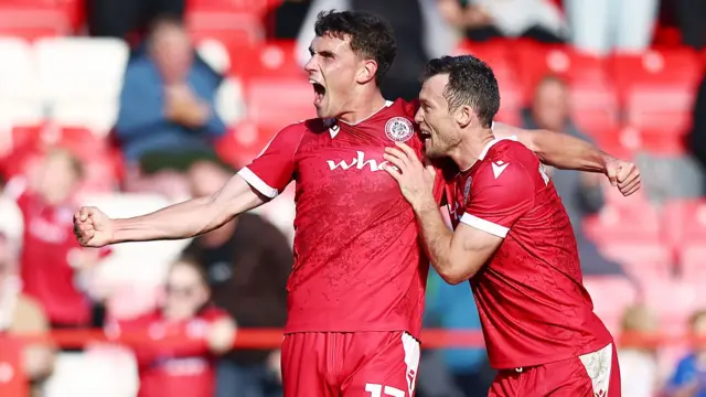 Dara Costelloe (left) celebrates with team-mate Shaun Whalley after scoring at Morecambe