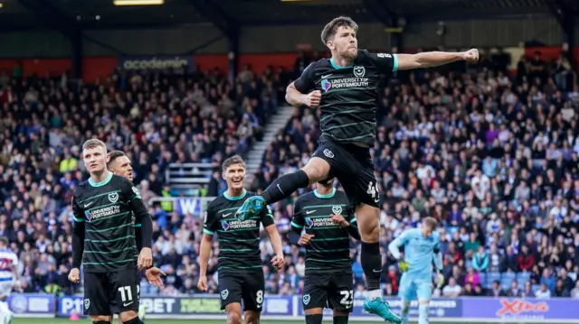 Callum Lang celebrates scoring the winner for Portsmouth