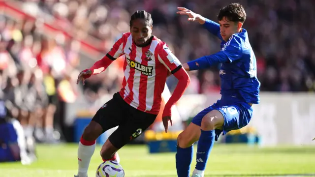 Southampton's Kyle Walker-Peters  and Leicester City's Facundo Buonanotte battle for the ball