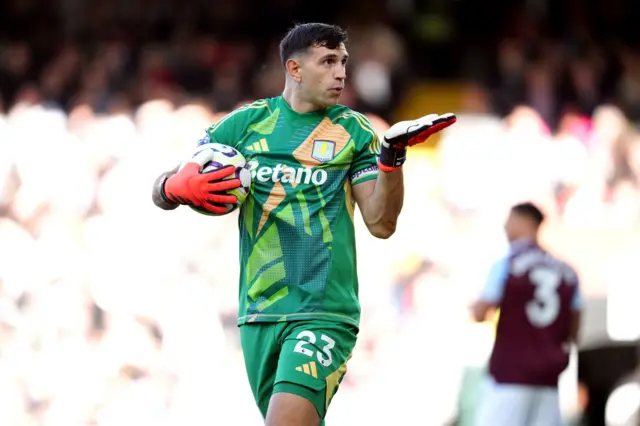 Aston Villa goalkeeper Emiliano Martinez celebrates after saving a penalty kick from Fulham's Andreas Pereira