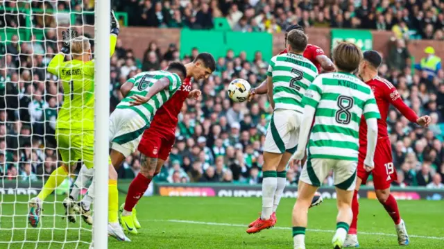 GLASGOW, SCOTLAND - OCTOBER 19: Aberdeen's Luis Lopes has the ball in the net to make it 3-2 but the goal is disallowed for a handball during a William Hill Premiership match between Celtic and Aberdeen at Celtic Park, on October 19, 2024, in Glasgow, Scotland. (Photo by Ross MacDonald / SNS Group)