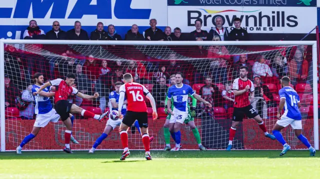 Bailey Cadamarteri opens the scoring for Lincoln against Birmingham