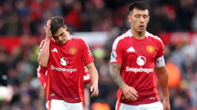 Manuel Ugarte of Manchester United shows dejection during the Premier League match against Tottenham