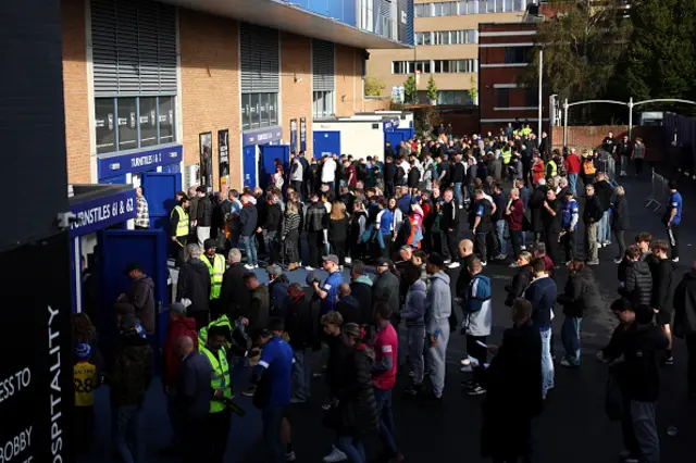 : A general view as fans are seen queuing to enter the stadium