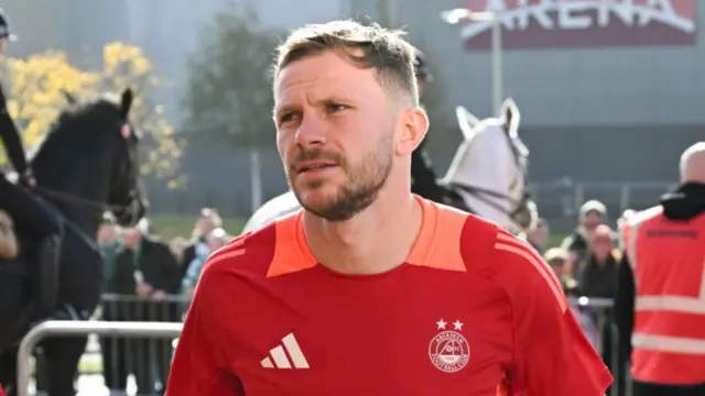 GLASGOW, SCOTLAND - OCTOBER 19: Aberdeen's Nicky Devlin arrives ahead of a William Hill Premiership match between Celtic and Aberdeen at Celtic Park, on October 19, 2024, in Glasgow, Scotland. (Photo by Rob Casey / SNS Group)