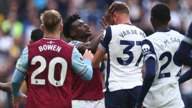 Mohammed Kudus of West Ham clashes with Micky van de Ven of Tottenham Hotspur