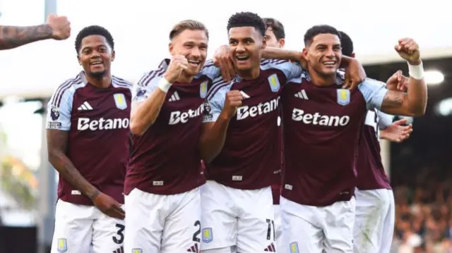 Matty Cash, Ollie Watkins and Diego Carlos of Aston Villa celebrate