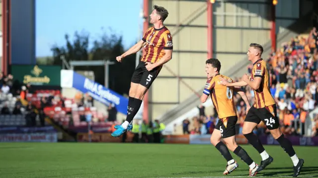 Bradford's Niall Byrne jumps for joy at Valley Parade