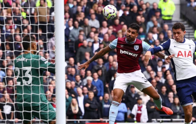 Emerson Palmieri in action with Tottenham Hotspur's Brennan Johnson