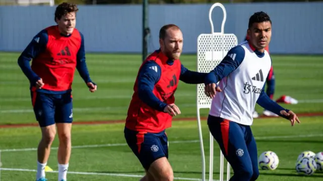 Christian Eriksen and Casemiro of Manchester United in action during a first team training session