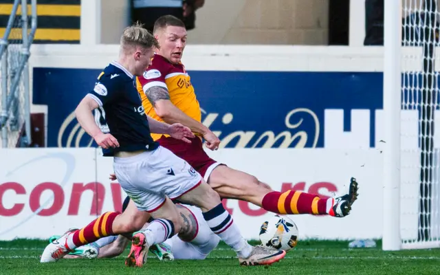 Dundee's Lyall Cameron scores to make it 1-0 during a William Hill Premiership match between Motherwell and Dundee at Fir Park,