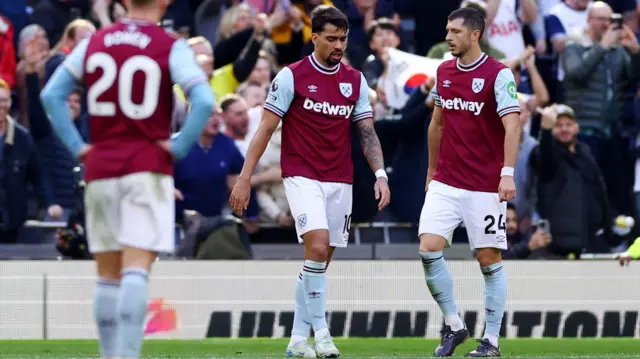 West Ham United's Lucas Paqueta and Guido Rodriguez look dejected after conceding their third goal