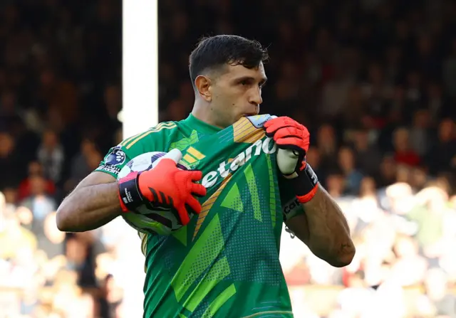 Emiliano Martinez reacts after saving a penalty