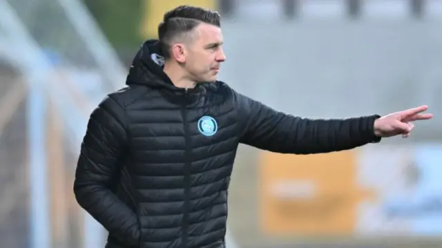 Wycombe boss Matt Bloomfield gesturing to his players from the touchline