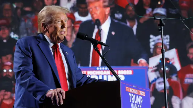 Republican presidential nominee and former U.S. President Donald Trump speaks during a rally at Huntington Place in Detroit, Michigan, U.S. October 18, 2024. REUTERS/Brian Snyder