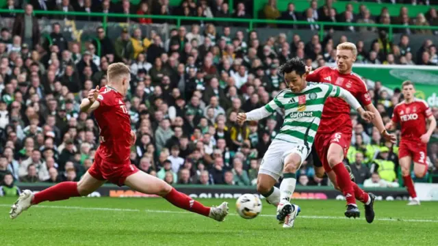 GLASGOW, SCOTLAND - OCTOBER 19: Celtic's Reo Hatate scores to make it 1-0 during a William Hill Premiership match between Celtic and Aberdeen at Celtic Park, on October 19, 2024, in Glasgow, Scotland. (Photo by Rob Casey / SNS Group)