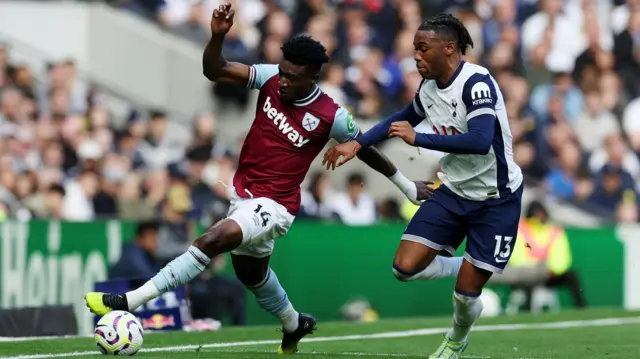 West Ham's Mohammed Kudus in action with Tottenham's Destiny Udogie