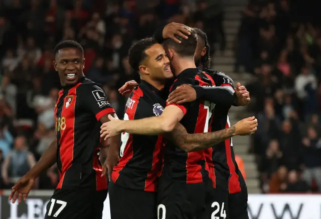 Christie is mobbed after his goal v Arsenal