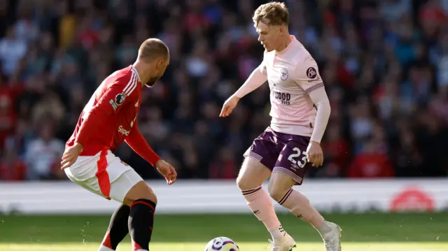 Brentford's Keane Lewis-Potter in action with Manchester United's Christian Eriksen