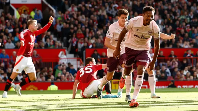 Brentford's Ethan Pinnock celebrates scoring their first goal with Christian Norgaard