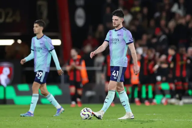 Rice brings the ball back to the centre circle after the second Bournemouth goal