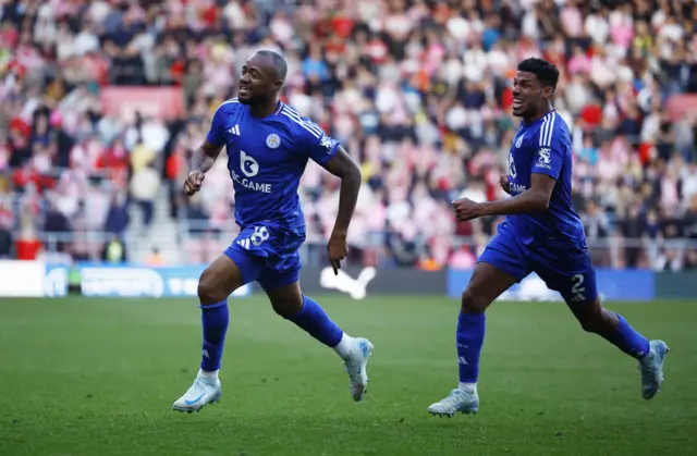 Leicester City's Jordan Ayew celebrates scoring their third goal with James Justin