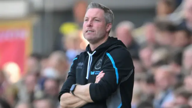 Millwall manager Neil Harris with his arms folded