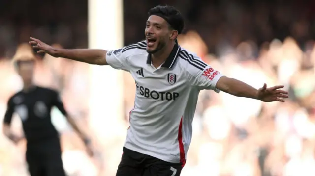 Raul Jimenez of Fulham celebrates scoring his team's first goal