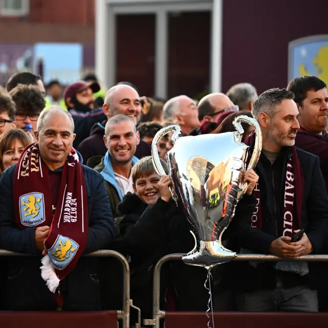 Villa fan holds a European Cup replica balloon outside the stadium