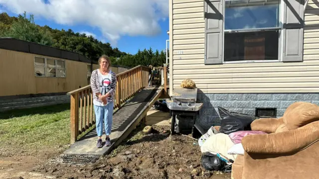 Cinda Galgano outside her trailer after flooding in Boone