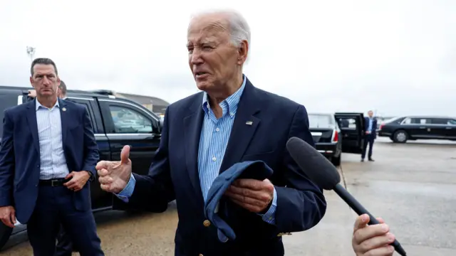 Joe Biden speaks to members of the media before boarding Air Force One