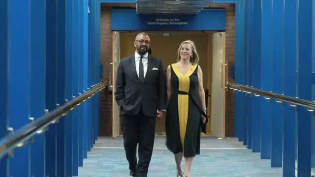 James Cleverly walks into conference with his wife Susannah