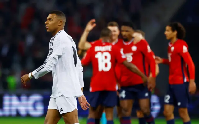 Mbappe walks off the pitch as Lille celebrate their win behind