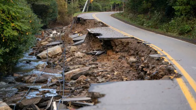 : A partially collapsed road in the aftermath of Hurricane Helene on October 1, 2024 near Black Mountain, North Carolina