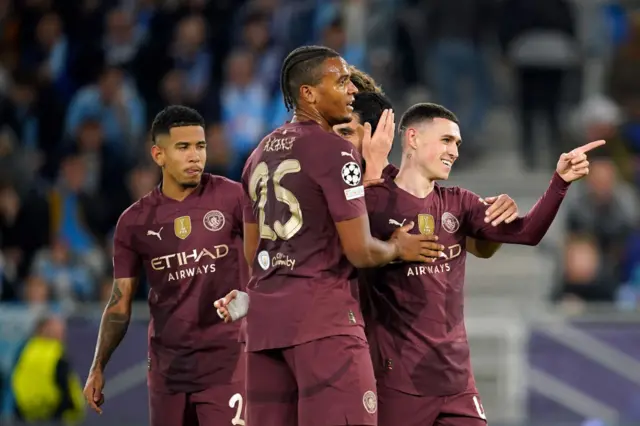 Phil Foden celebrates with Manchester City teammates