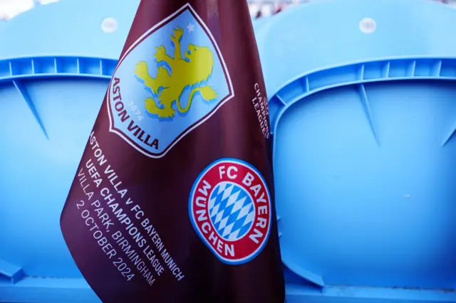 Flag with Villa and Bayern crests sits waiting for a fan on a seat at Villa park