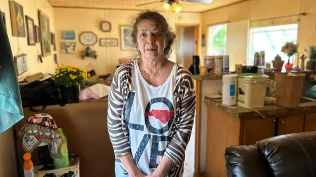 Cinda Galgano inside her home after flooding