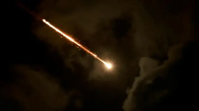 A projectile seen from Tel Aviv last night, as Iran carried out its missile attack