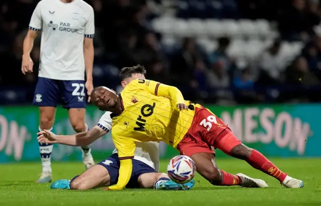 Preston North End's Andrew Hughes challenged Watford's Edo Kayembe