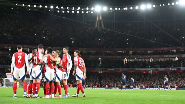 Bukayo Saka of Arsenal celebrates with teammates after scoring his team's second goal during the UEFA Champions League 2024/25 League Phase MD2 match between Arsenal FC and Paris Saint-Germain at Emirates Stadium on October 01, 2024 in London, England.