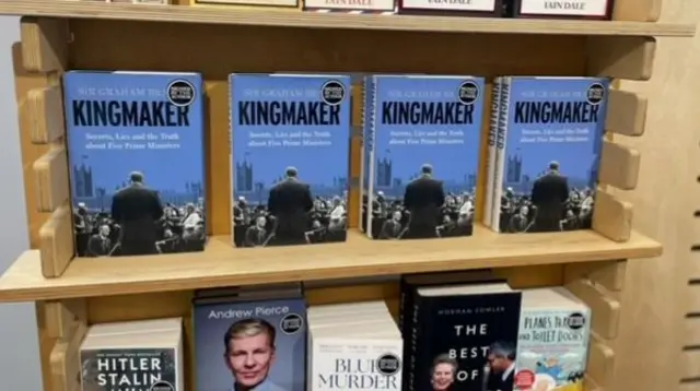 Bookshelf with copies of Kingmaker