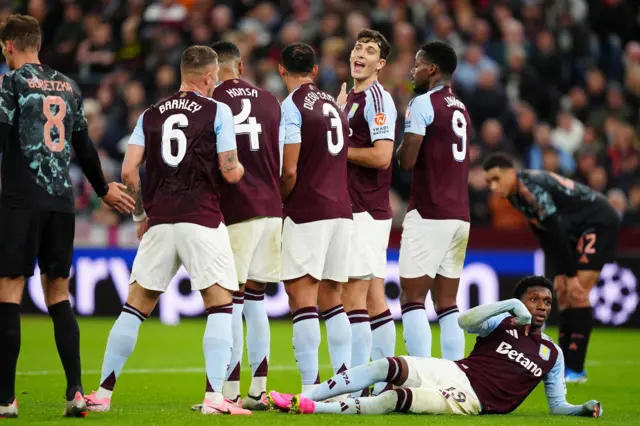 Villa defenders prepare to defend a set piece in their wall line