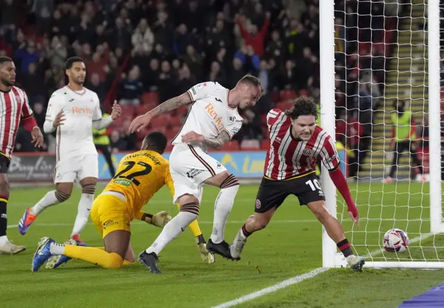 Swansea City's Josh Tymon scores an own goal